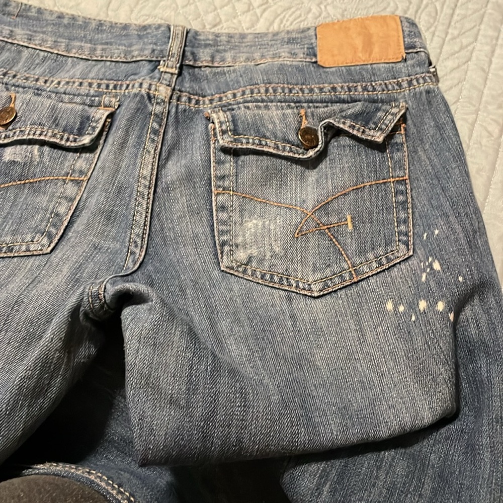 Distressed Blue Denim Jeans